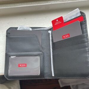 TUMI Blue Passport Case 
Brand New in Box